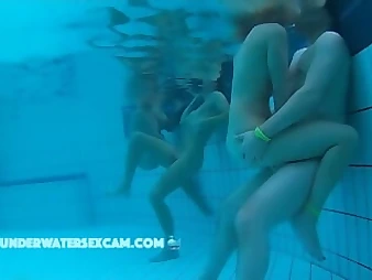 Witness these crazy nubile babes enjoyment each other in a public pool, no shame!